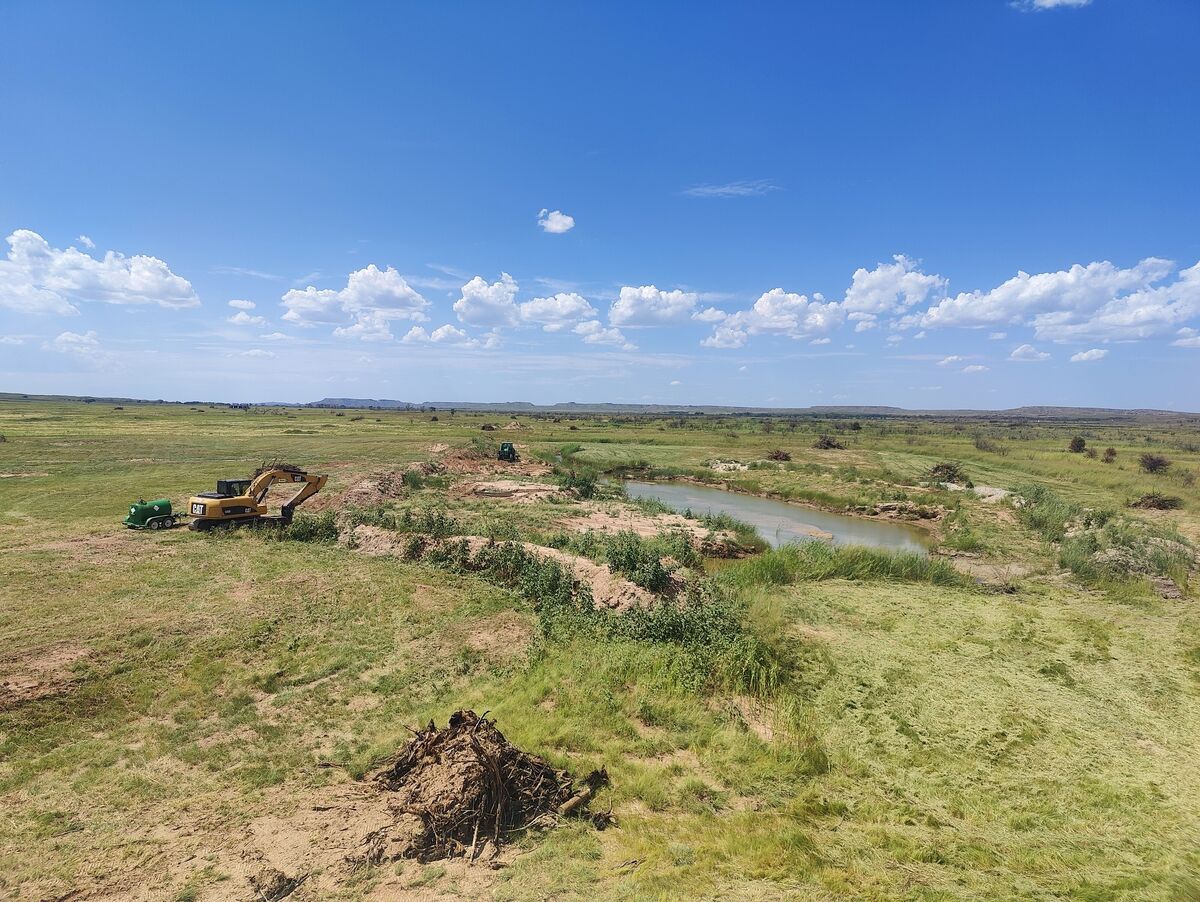 Pond excavation in progress on Texas Panhandle pasture land